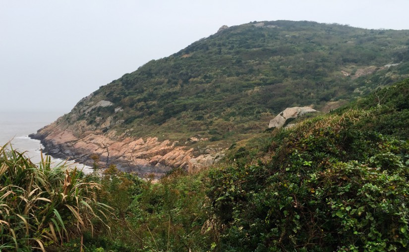 Rock, sea, and hills covered with original Sijiao scrub.