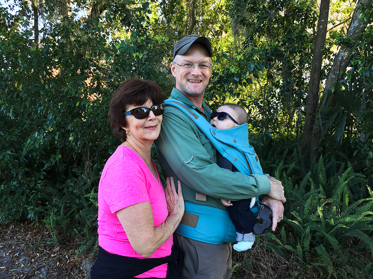 My mother (L) is ecstatic over the return of her son and arrival of her newest grandson. I told her, 'This time you got me. I'll never live abroad again.' With Tiny in tow, we were birding 3 March 2018 near my parents' house in Debary, Florida. (Elaine Du)